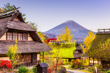 Mt. Fuji, Japan and Traditional Village during autumn.