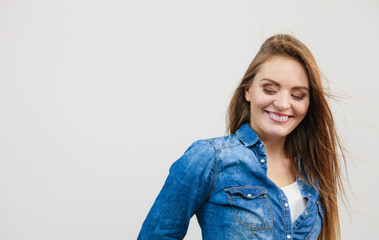 Happy smiling woman wearing jeans