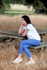 Fototapeta premium Relaxed cool girl in a beautiful park