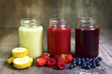 Three portions of different smoothies.