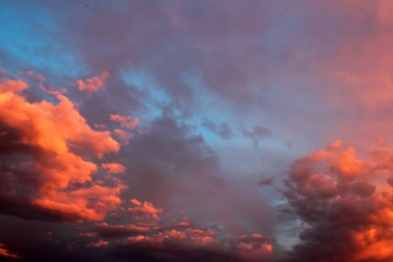 Obraz premium Sunset orange clouds in evening sky