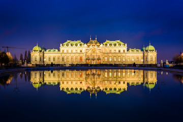 Belvedere Palace reflecting in a pool at night, in Vienna, Austr