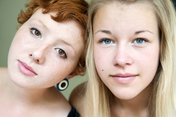 Portrait of redhair young woman and blonde teenage girl (16-17)