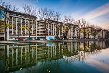 Buildings reflecting in Canal Saint-Martin, in Paris, France.