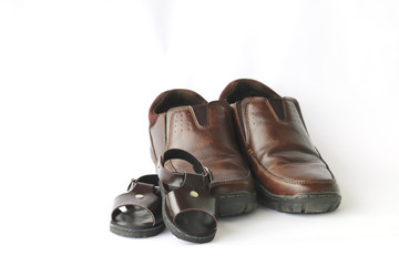 Stock Photo:.Daddy's boots and baby's shoes