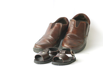 Stock Photo:.Daddy's boots and baby's shoes