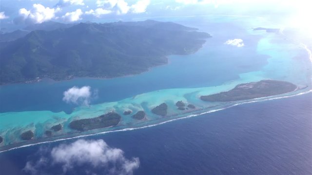 AERIAL: Flying above beautiful exotic Bora Bora island resort