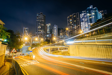 Fototapeta na wymiar Long exposure of traffic on Upper Albert Road, and modern skyscr