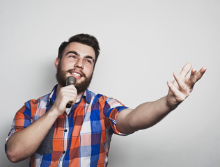 Fototapeta premium young singer with microphone