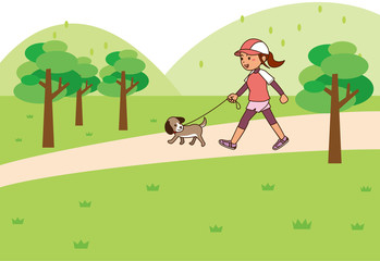 Obraz na płótnie Canvas 広場で犬の散歩をしながらウォーキングをする女性