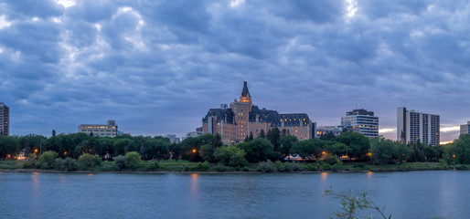 Saskatoon skyline at night along the Saskatchewan River.