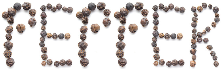 Black peppercorns organized to spell out the word "PEPPER" - isolated