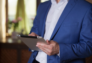 Professional businessman working at desk and using a touch scree