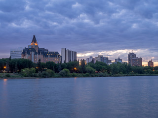 Fototapeta na wymiar Saskatoon skyline at night along the Saskatchewan River.