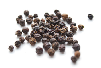 Black peppercorns, macro, isolated