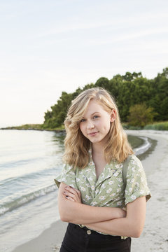 Sweden, Blekinge, Hallevik, Portrait of teenage girl (16-17) standing on beach