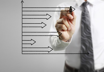 Businessman drawing graphics  growing graph