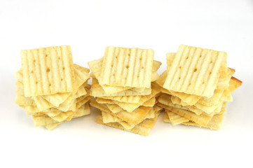 crispy crackers arranged and isolated on white background