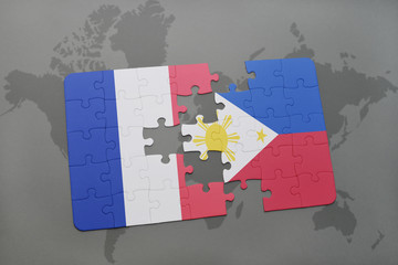 puzzle with the national flag of france and philippines on a world map background.