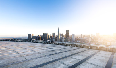 empty street with cityscape and skyline of san francisco at sunr