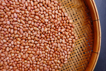 peanut beans with bamboo texture background