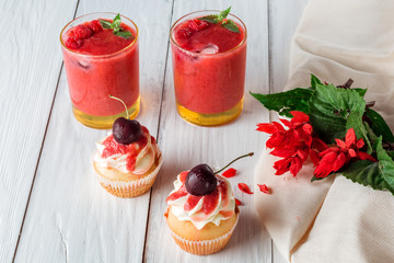 cupcakes with cherries and berry smoothies