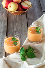 Obraz na płótnie Canvas two glasses of fruit smoothies