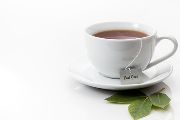 A cup of Earl Grey tea in a white cup and saucer
- 115584407