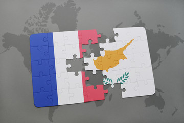 puzzle with the national flag of france and cyprus on a world map background.