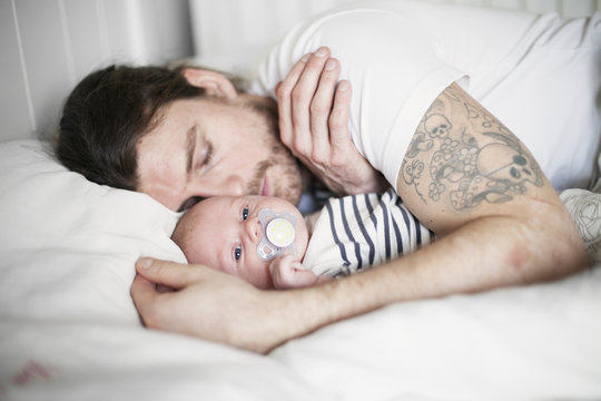 Sweden, Father and baby boy (0-1 months) resting