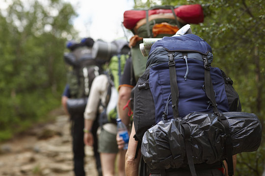 Sweden, Jamtland, People hiking with backpacks