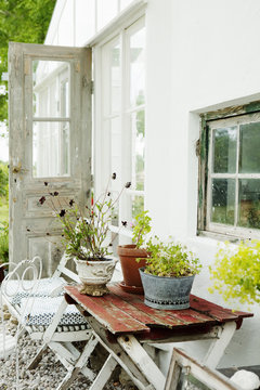 Sweden, Gotland, Bursvik, Burgegard, View of glass patio next to house