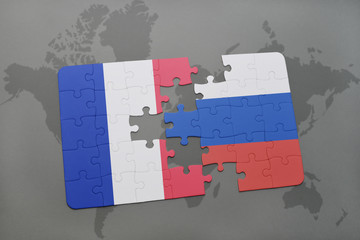 puzzle with the national flag of france and russia on a world map background.