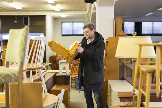 Sweden, Man choosing furniture in store