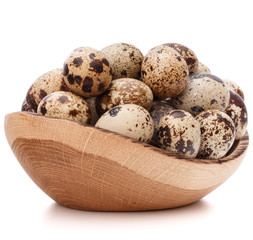 Obraz premium quail eggs in wooden bowl isolated on white background cutout