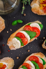 Bruschetta with tomatoes, mozzarella and basil