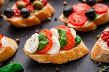 Bruschetta with tomatoes, mozzarella and basil