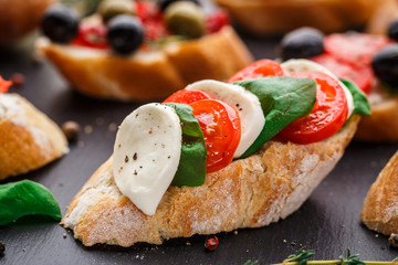 Bruschetta with tomatoes, mozzarella and basil