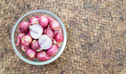 Shallot in a cup on thai threshing basket