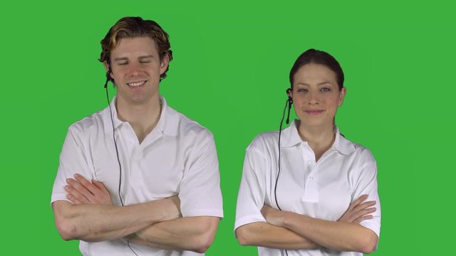 Couple of happy customer service reps (Green Key)