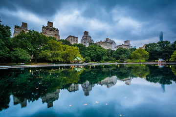 Buildings reflecting in the Conservatory Water in Central Park,
