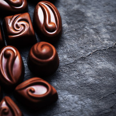 Chocolate over black background. Chocolate Candy, Cocoa. Assortm