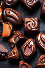 Chocolate over black background. Chocolate Candy, Cocoa. Assortm