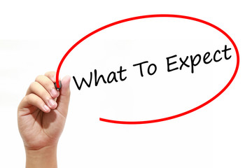 Man Hand writing What To Expect with marker on transparent wipe board. Business, internet, technology concept.