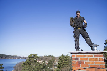 Chimney cleaner standing on chimney