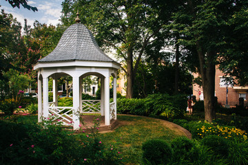 Colorful gardens and gazebo in a park in Alexandria, Virginia.