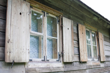 Fototapeta na wymiar Wooden window shutters on a medieval house