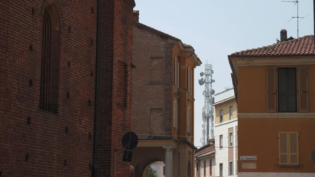Radio mast in the distance seen from town, Mortara, PV, Italy
