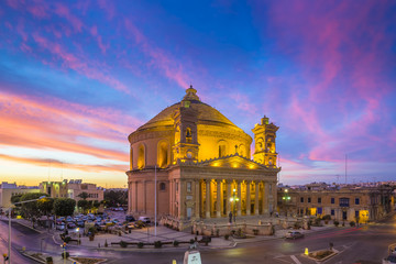Malta - The famous Mosta Dome with amazing colorful sky at sunset
