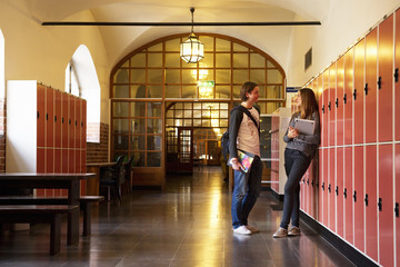 Students talking in school corridor